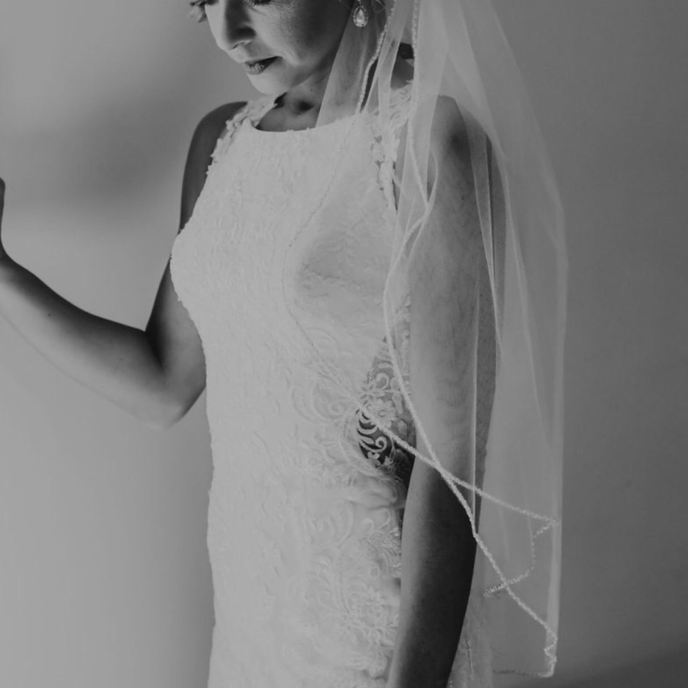 Two tiered wedding veil. Wore one time. Looks new.